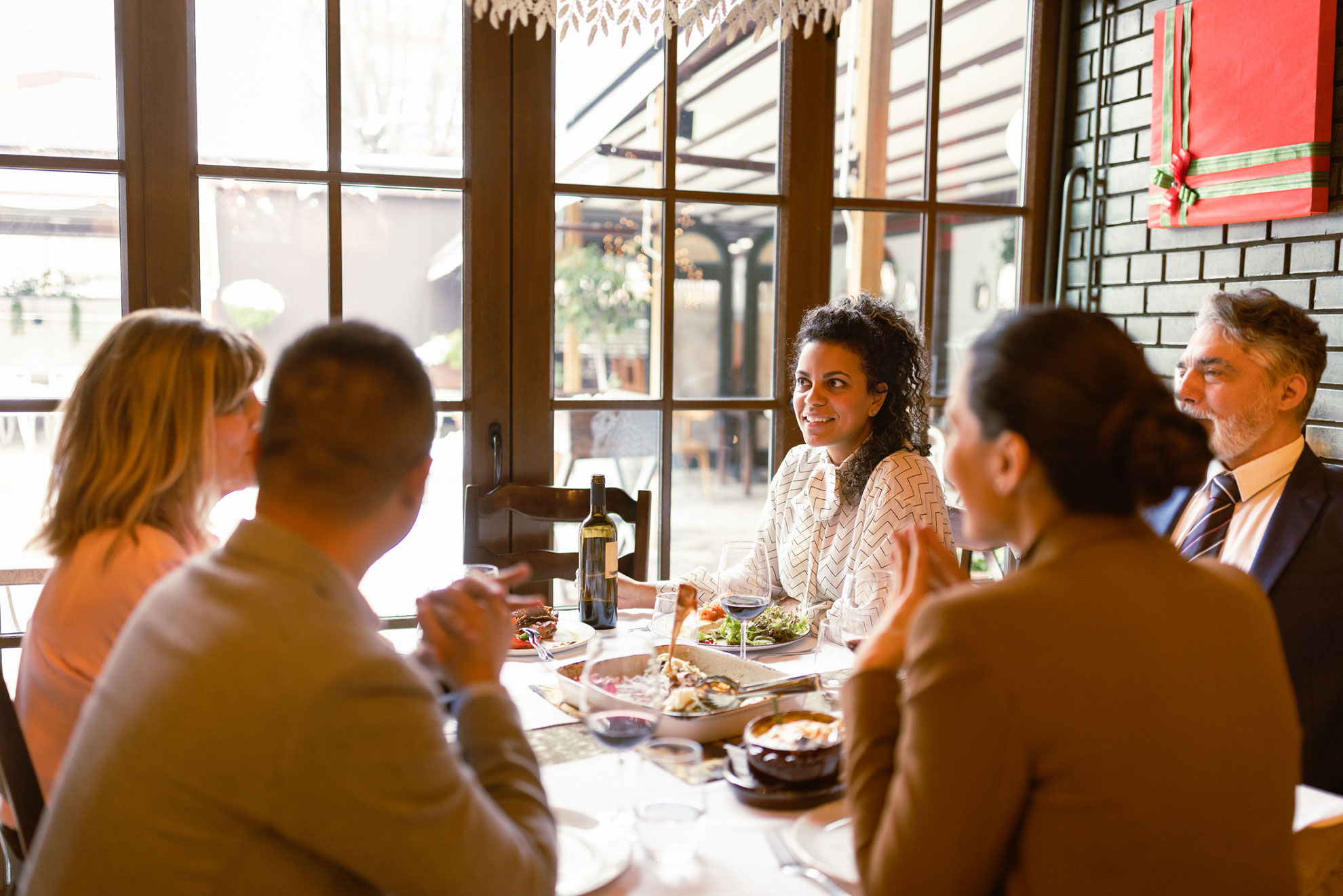 Family enjoying dinner at restaurant